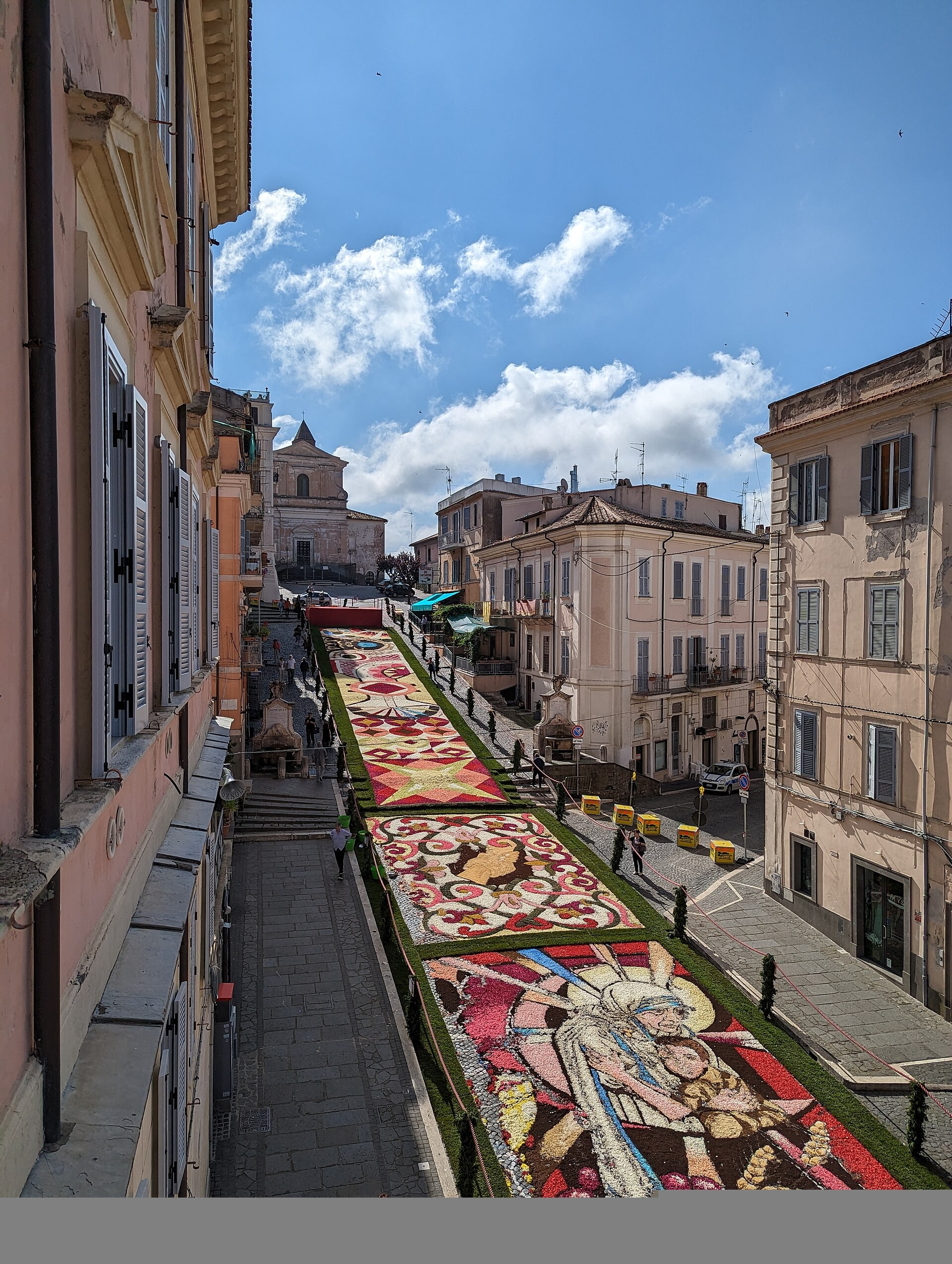 Genzano’s Infiorata flower carpet viewed along Via Italo Belardi